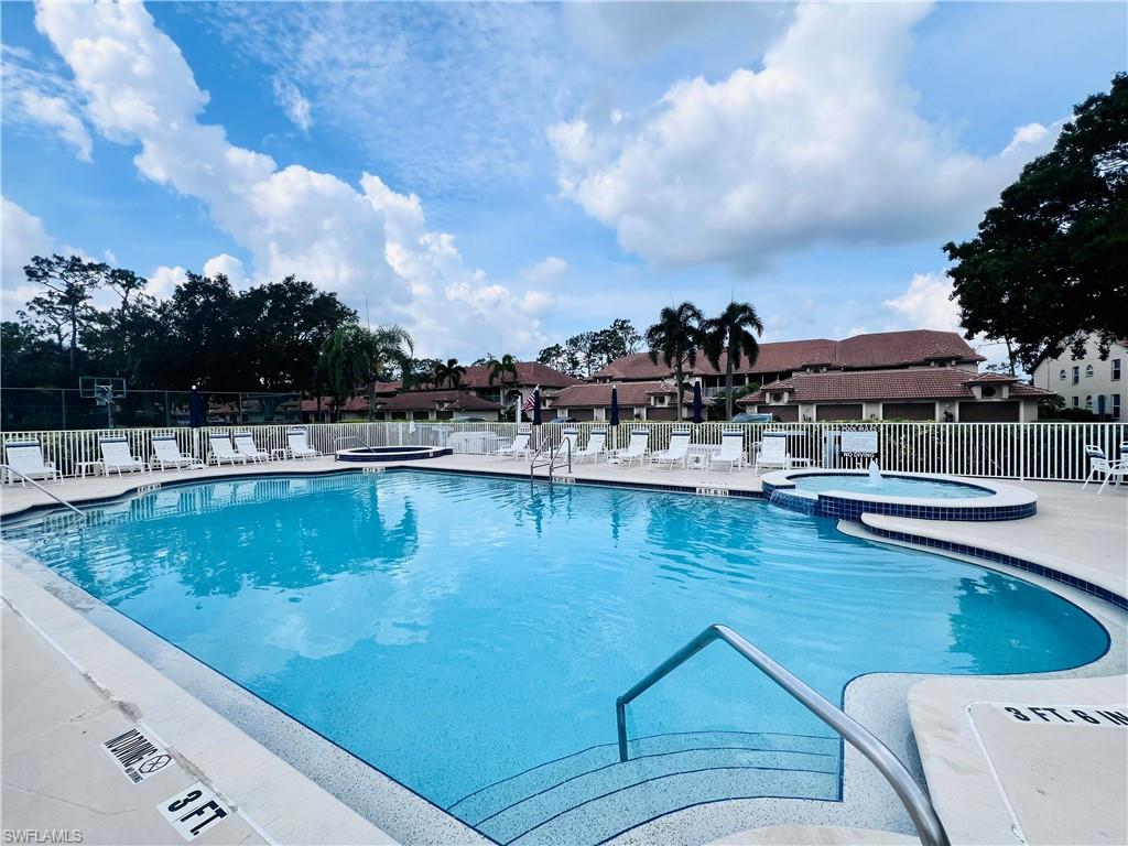 8073 Panther Trail, Unit 1404 Naples, FL 34113 - Photo 28 of 29 a view of swimming pool with outdoor seating