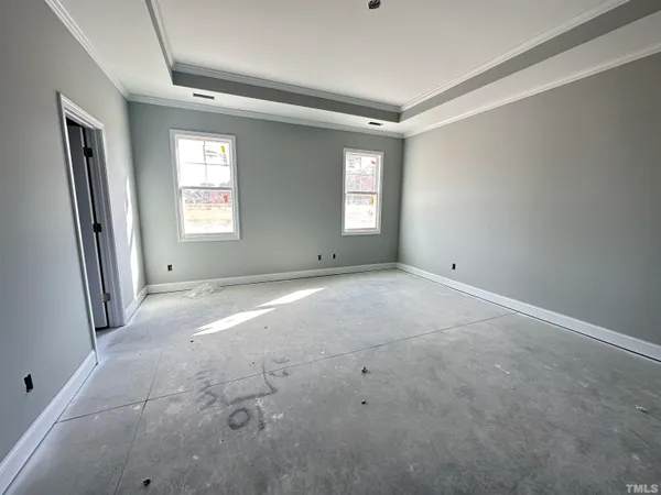 a view of empty room with windows