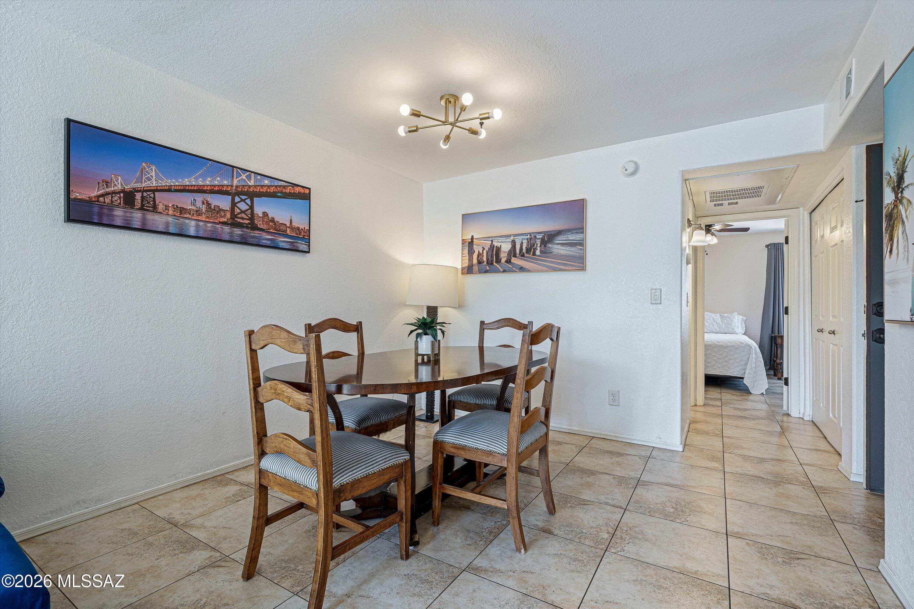 5800 North Kolb Road, Unit 5125 Tucson, AZ 85750 - Photo 8 of 34 a view of a dining room with furniture
