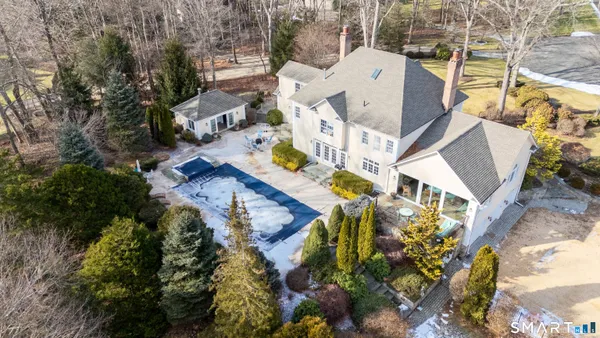 an aerial view of a house with outdoor space