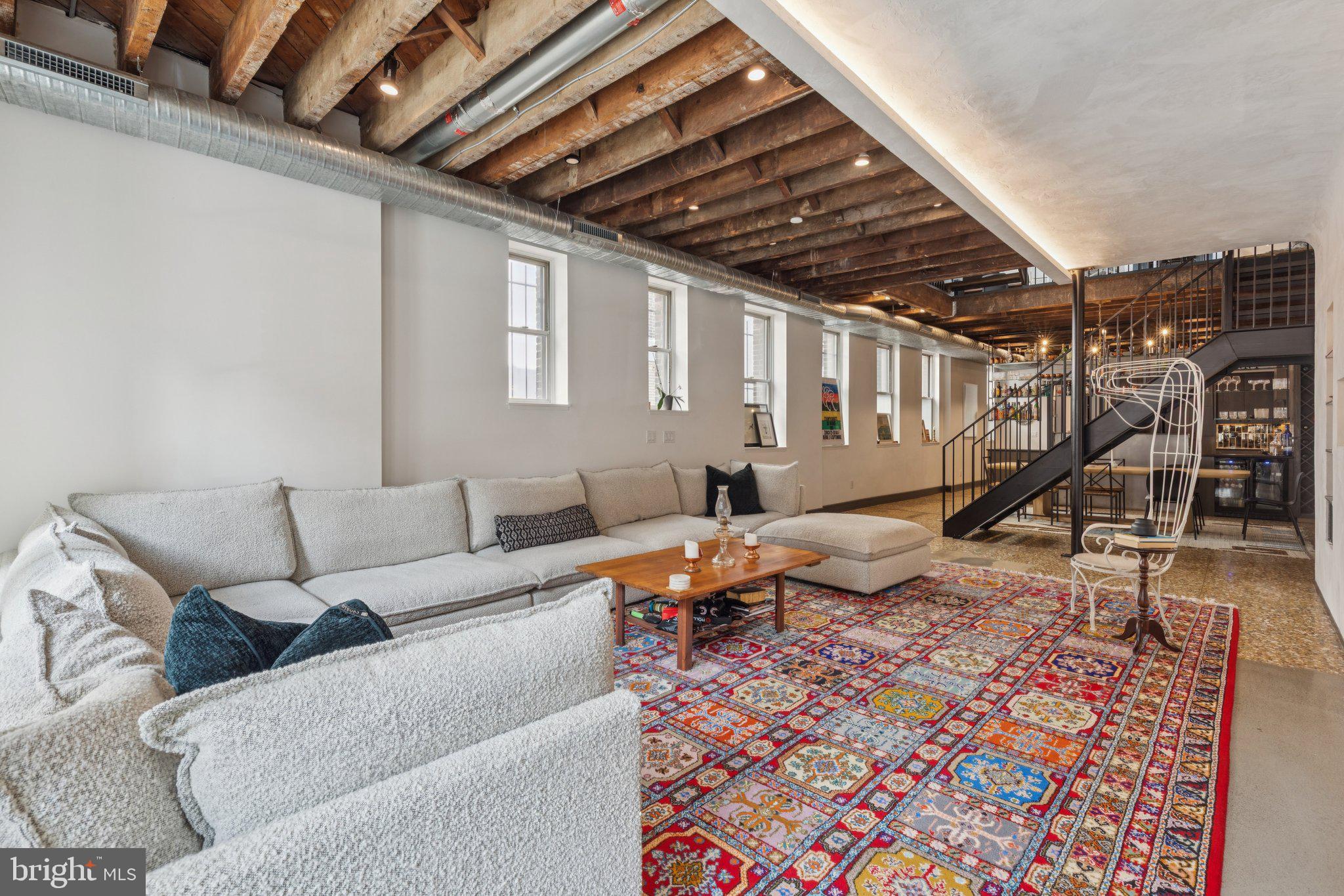 207 South 24th Street Philadelphia, PA 19103 - Photo 12 of 47 a living room with furniture a wooden floor and a rug