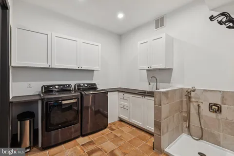 a kitchen with a stove and a sink