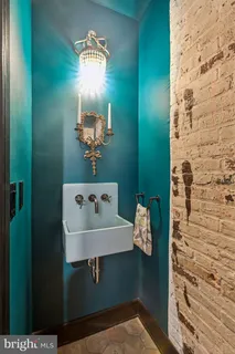 a bathroom with a sink and mirror