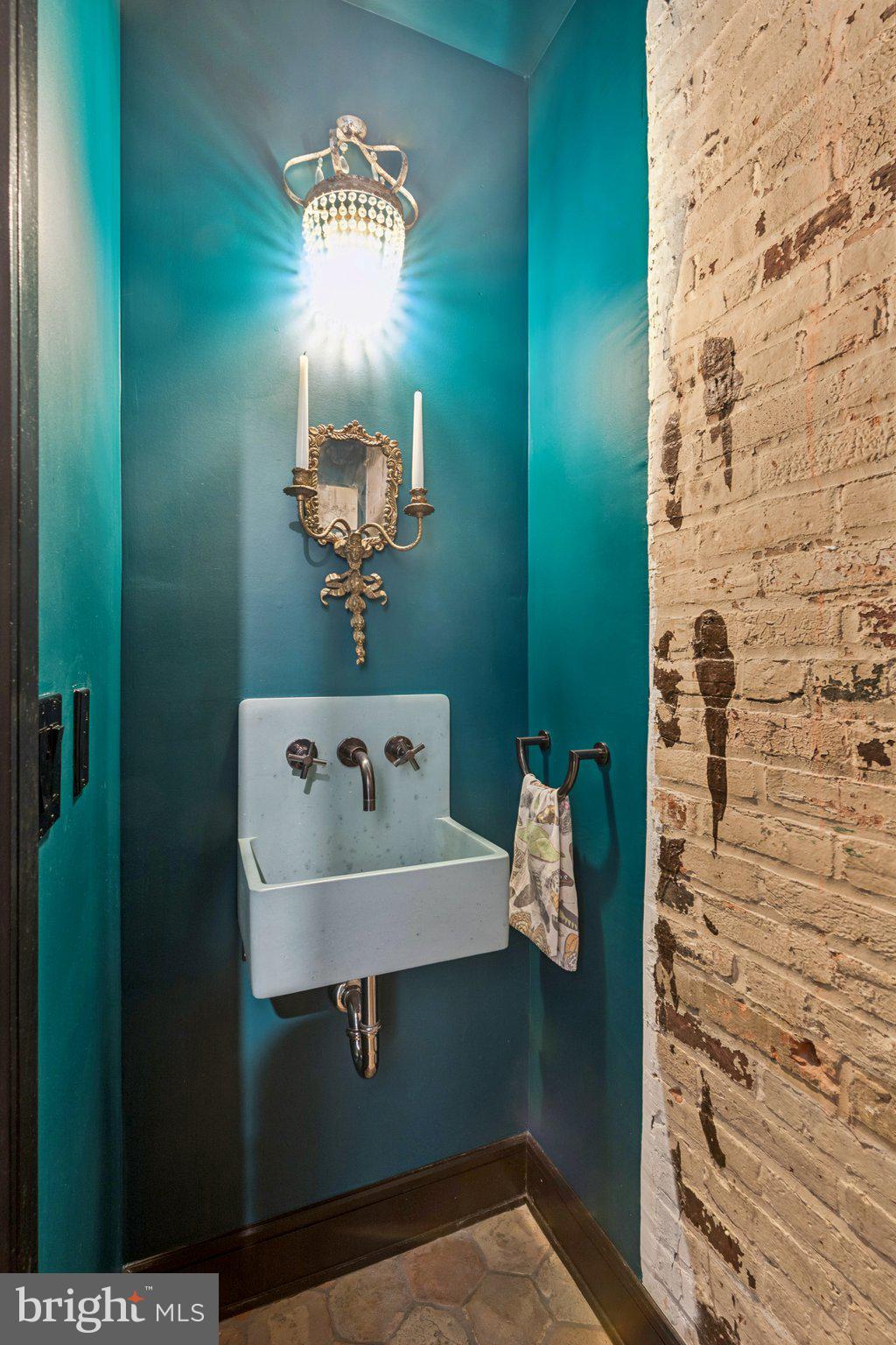 207 South 24th Street Philadelphia, PA 19103 - Photo 15 of 47 a bathroom with a sink and mirror