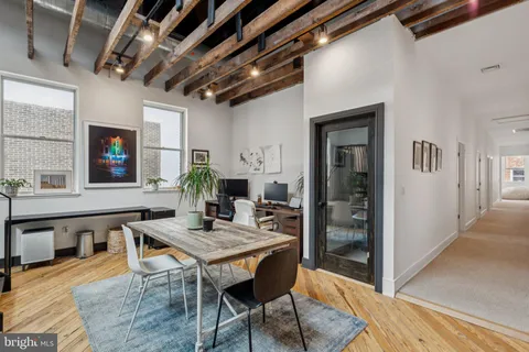 a workspace with furniture and window