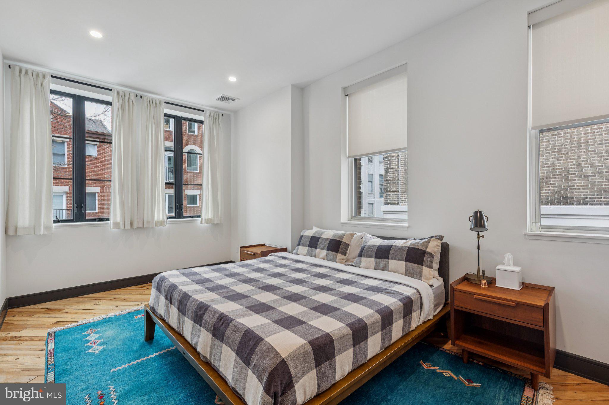 207 South 24th Street Philadelphia, PA 19103 - Photo 20 of 47 a bedroom with bed and a window