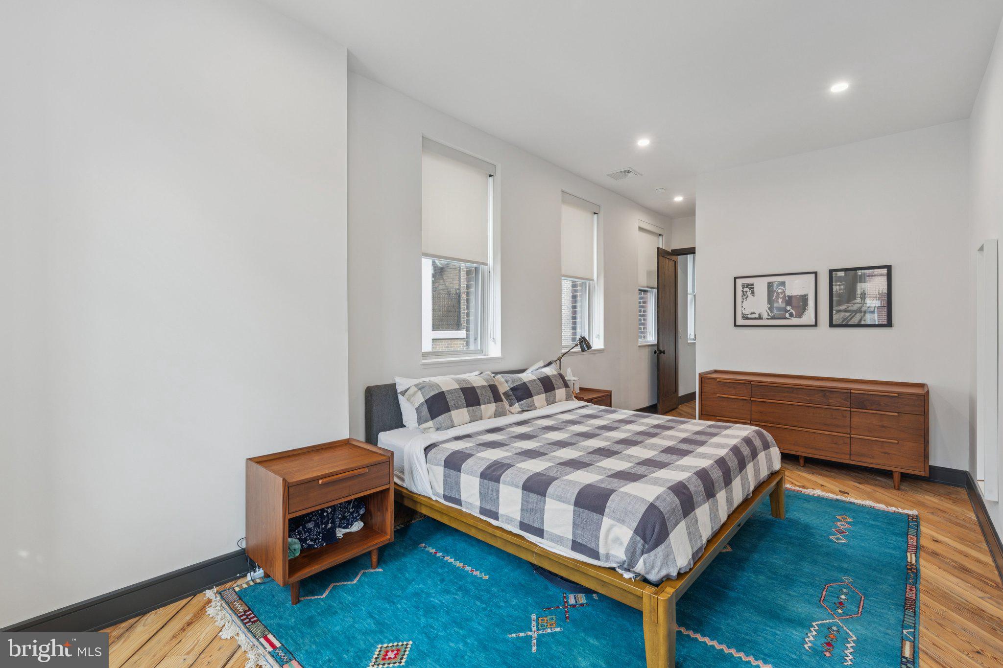 207 South 24th Street Philadelphia, PA 19103 - Photo 21 of 47 a bedroom with a bed and a couch