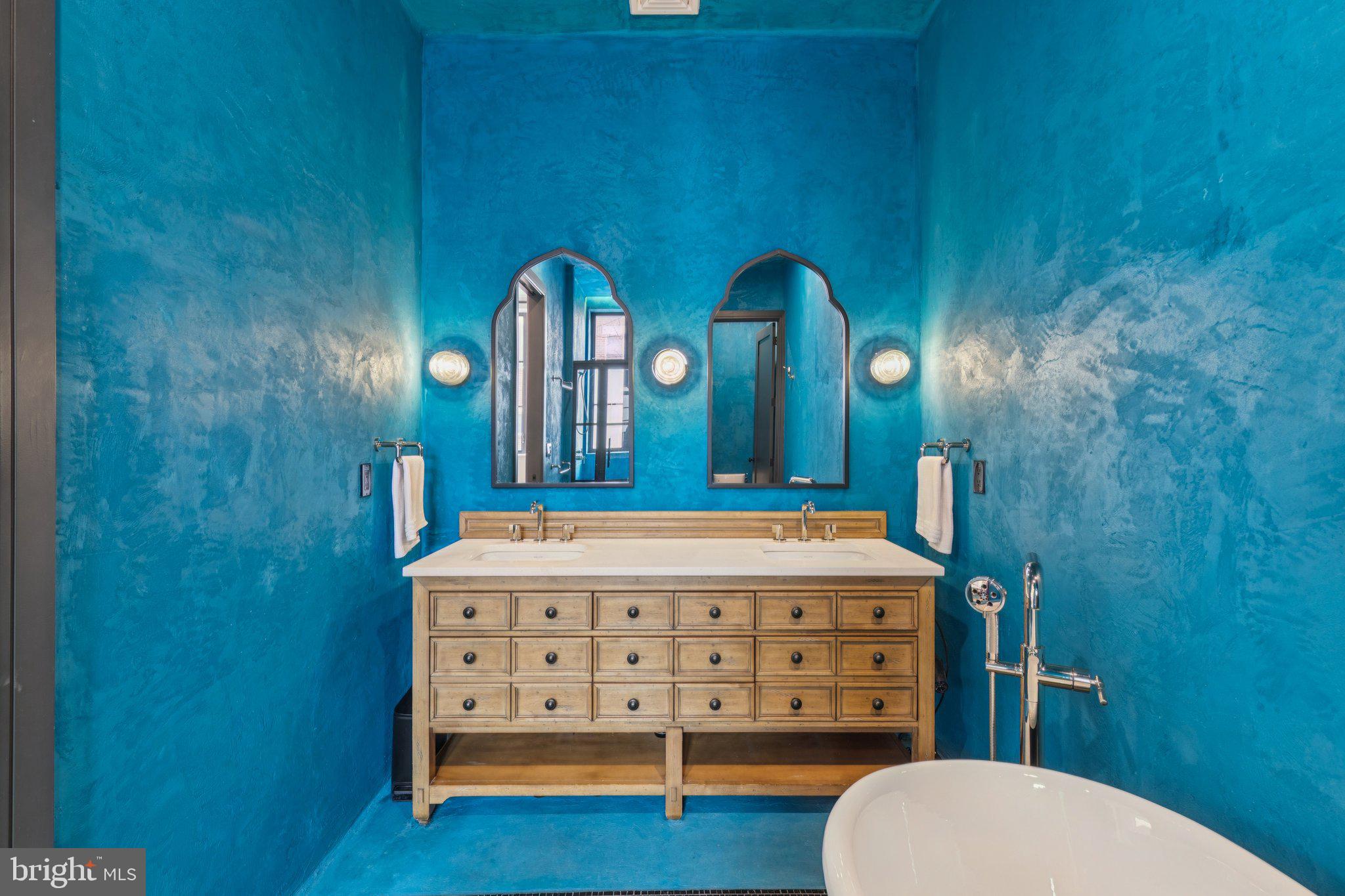 207 South 24th Street Philadelphia, PA 19103 - Photo 22 of 47 a bathroom with a sink a mirror a toilet and a bathtub