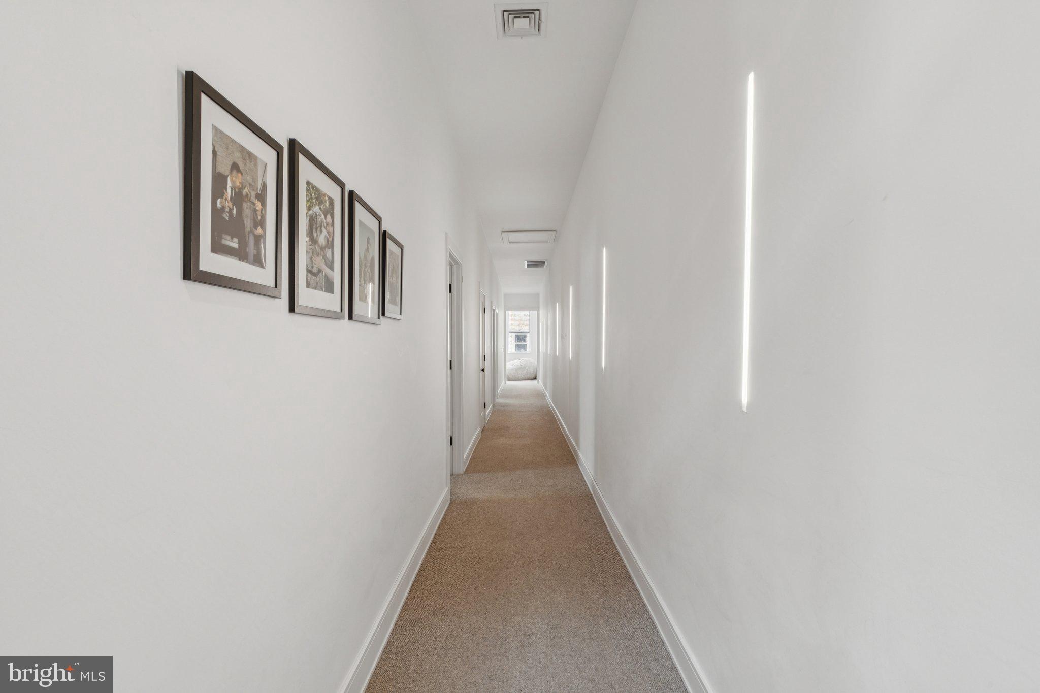 207 South 24th Street Philadelphia, PA 19103 - Photo 24 of 47 a view of a hallway with wooden floor