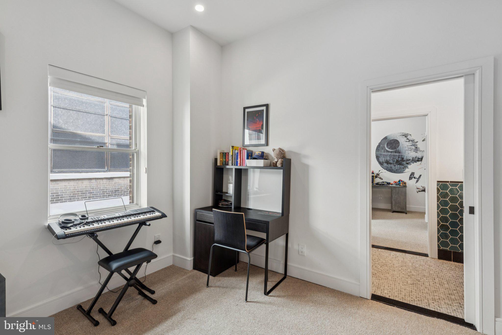 207 South 24th Street Philadelphia, PA 19103 - Photo 26 of 47 a view of a workspace with furniture and a window