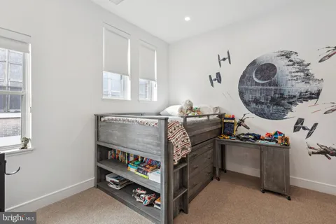 a bed room with a bed and a fish tank