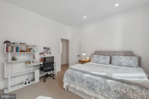 a bedroom with a bed and a cabinets