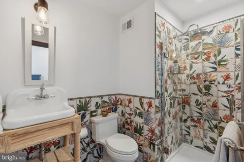 a bathroom with a sink and toilet