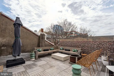 a view of a terrace with chairs