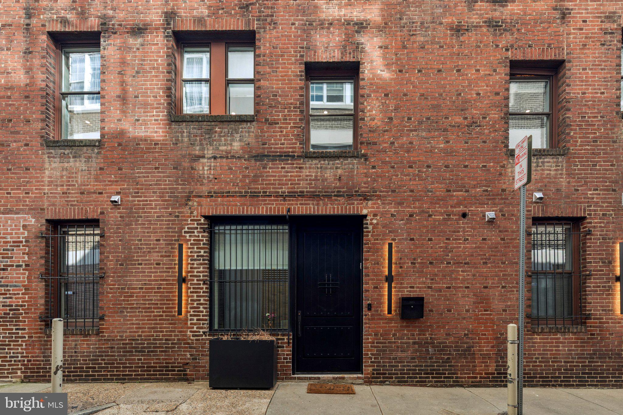 207 South 24th Street Philadelphia, PA 19103 - Photo 45 of 47 a front view of a brick house with a door