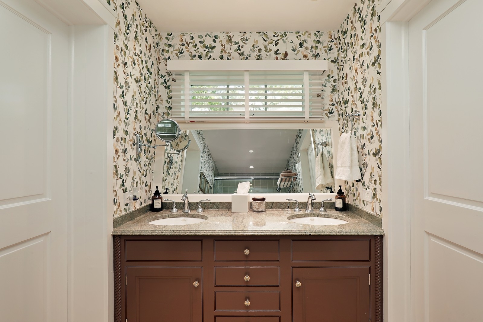 100 Beach Road Glencoe, IL 60022 - Photo 25 of 40 a bathroom with a sink vanity and a mirror