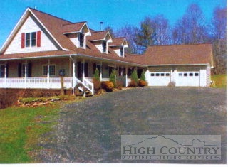 488 McNeil Road Warrensville, NC 28693 - Photo 1 of 1 a front view of a house with a yard