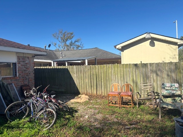 4807 Redfish Reef Drive Bacliff, TX 77518 - Photo 3 of 16 a backyard of a house with table and chairs