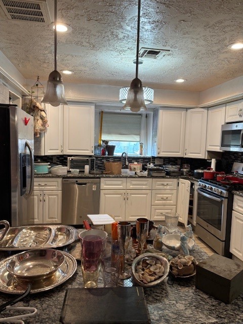 4807 Redfish Reef Drive Bacliff, TX 77518 - Photo 4 of 16 a kitchen with sink refrigerator and stove