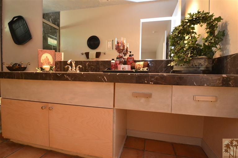 71966 Vista Del Rio Rancho Mirage, CA 92270 - Photo 8 of 23 a bathroom with a sink and a mirror