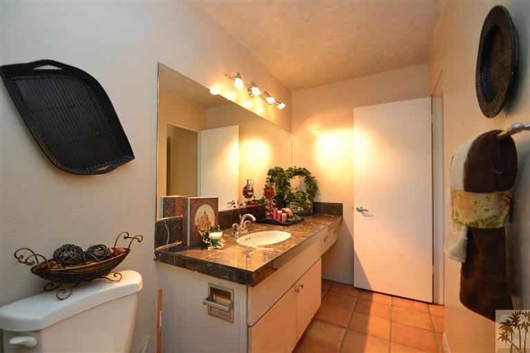71966 Vista Del Rio Rancho Mirage, CA 92270 - Photo 10 of 23 a bathroom with a sink and a mirror