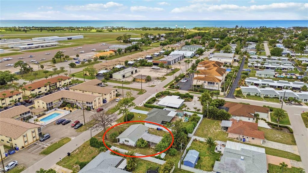 309 Base Avenue East Venice, FL 34285 - Photo 1 of 36 an aerial view of residential houses with outdoor space