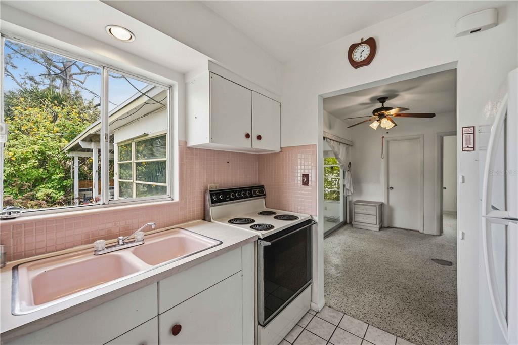 309 Base Avenue East Venice, FL 34285 - Photo 14 of 36 a kitchen that has a sink and a stove