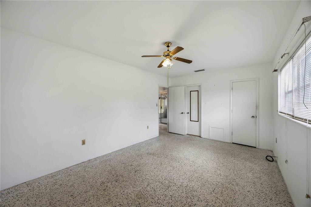 309 Base Avenue East Venice, FL 34285 - Photo 18 of 36 a view of a livingroom with a ceiling fan and window