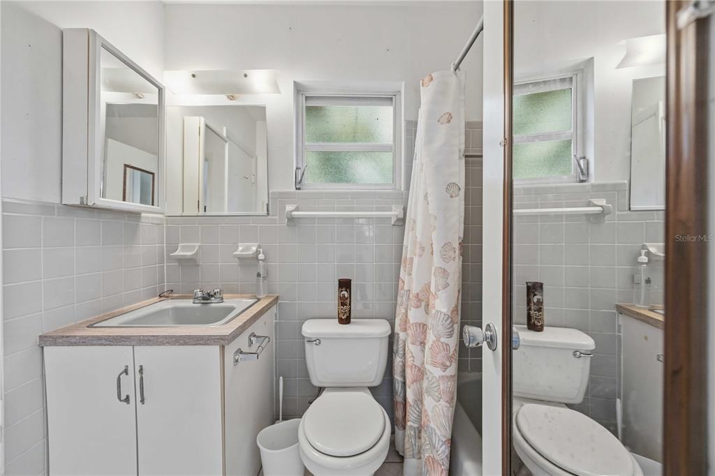 309 Base Avenue East Venice, FL 34285 - Photo 20 of 36 a bathroom with a sink a toilet and shower