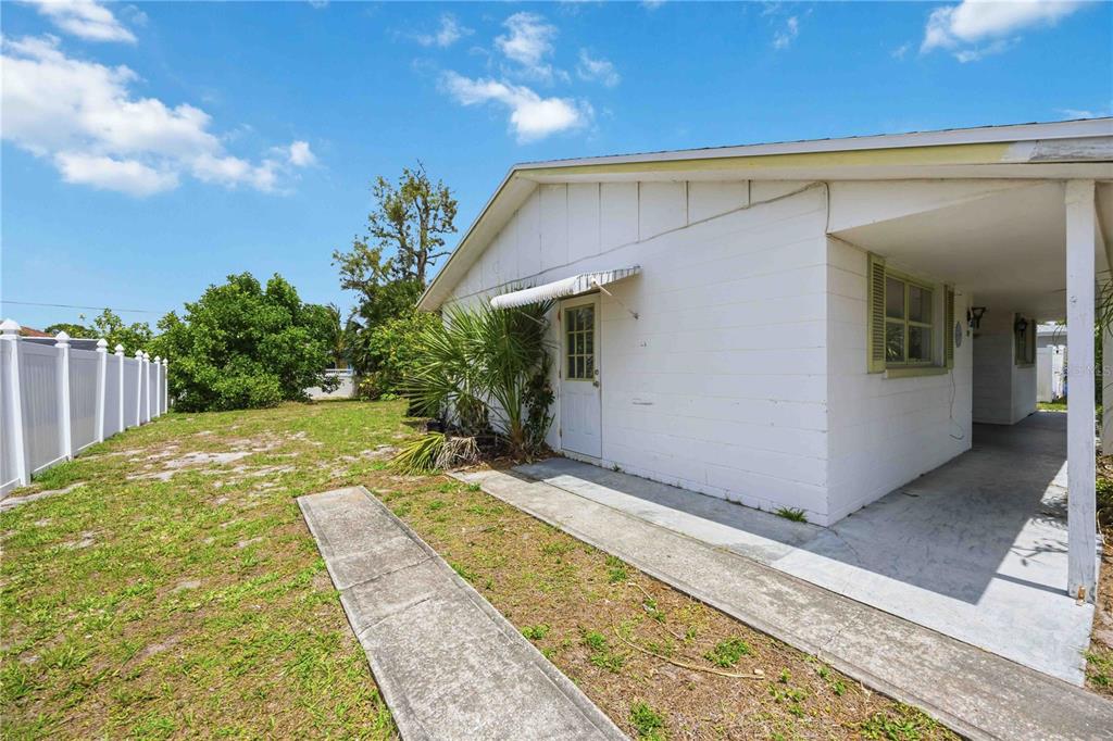 309 Base Avenue East Venice, FL 34285 - Photo 21 of 36 a view of a house with backyard and sitting area