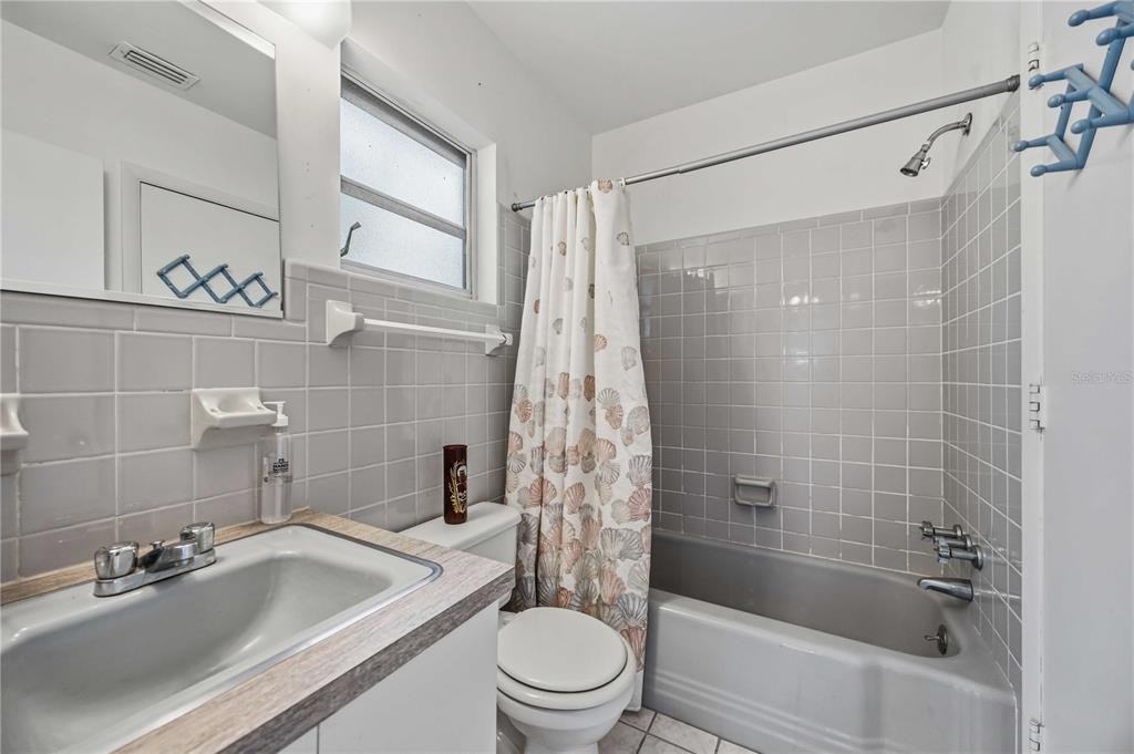 309 Base Avenue East Venice, FL 34285 - Photo 22 of 36 a bathroom with a sink a toilet and shower