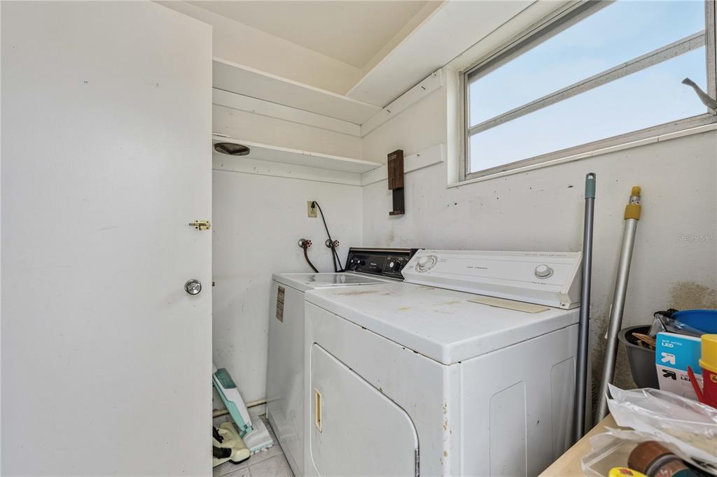 309 Base Avenue East Venice, FL 34285 - Photo 23 of 36 a utility room with dryer and washer