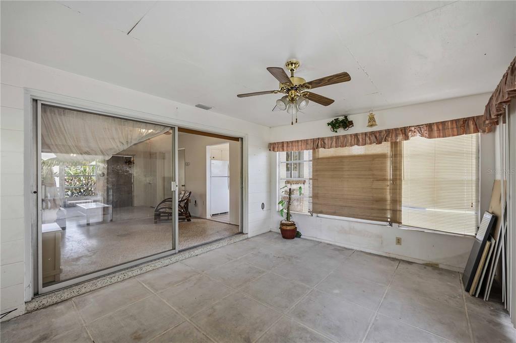 309 Base Avenue East Venice, FL 34285 - Photo 26 of 36 a view of empty room with wooden floor and fan