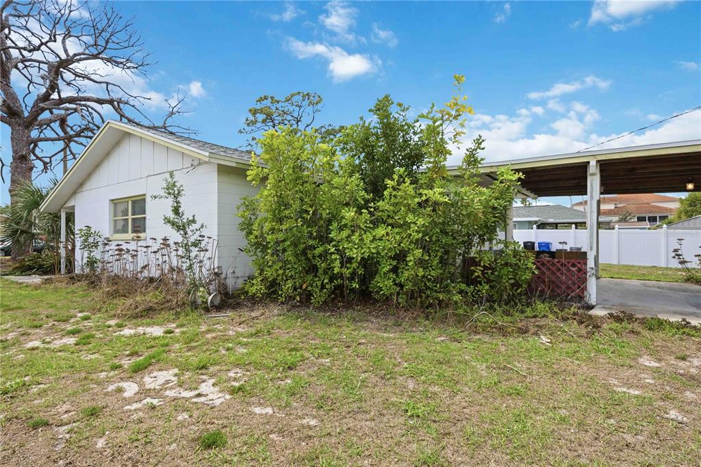 309 Base Avenue East Venice, FL 34285 - Photo 30 of 36 a view of a house with a yard