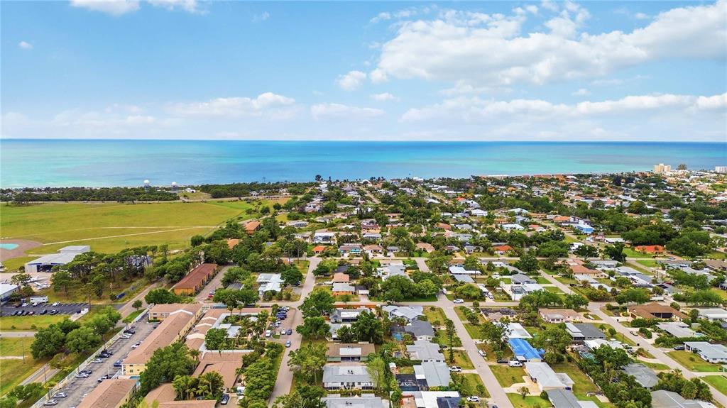 309 Base Avenue East Venice, FL 34285 - Photo 34 of 36 an aerial view of residential building and ocean