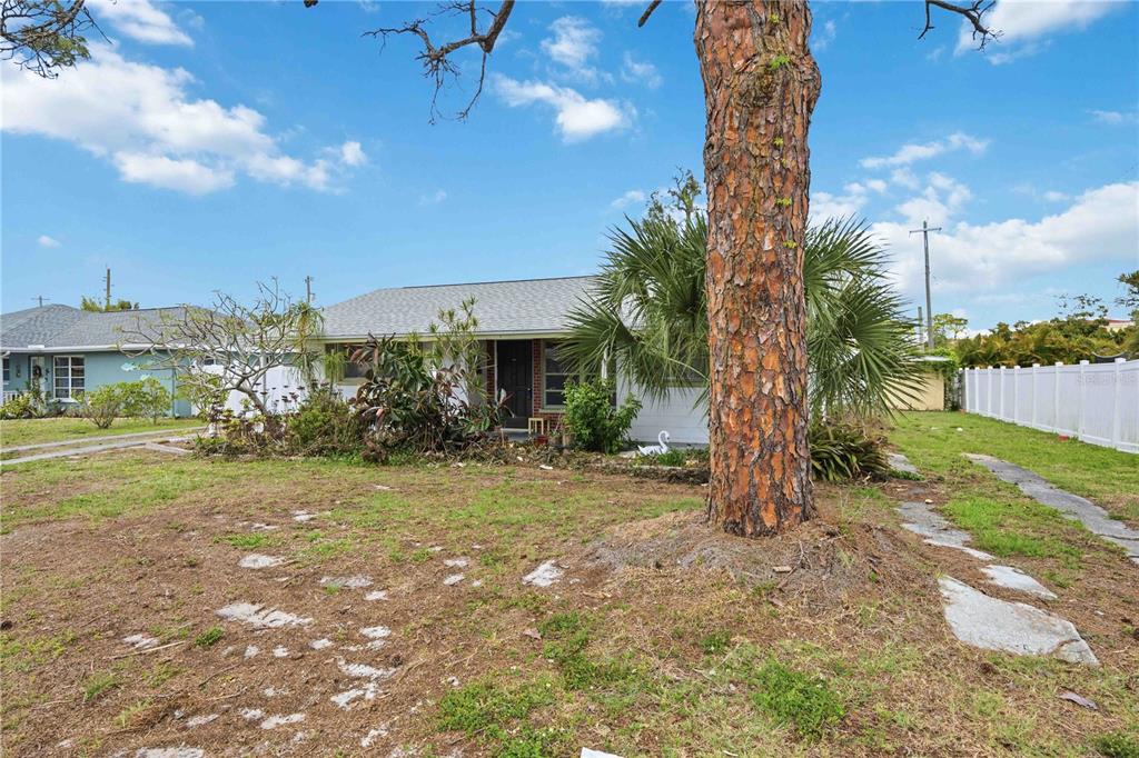 309 Base Avenue East Venice, FL 34285 - Photo 5 of 36 a view of a yard in front of the house