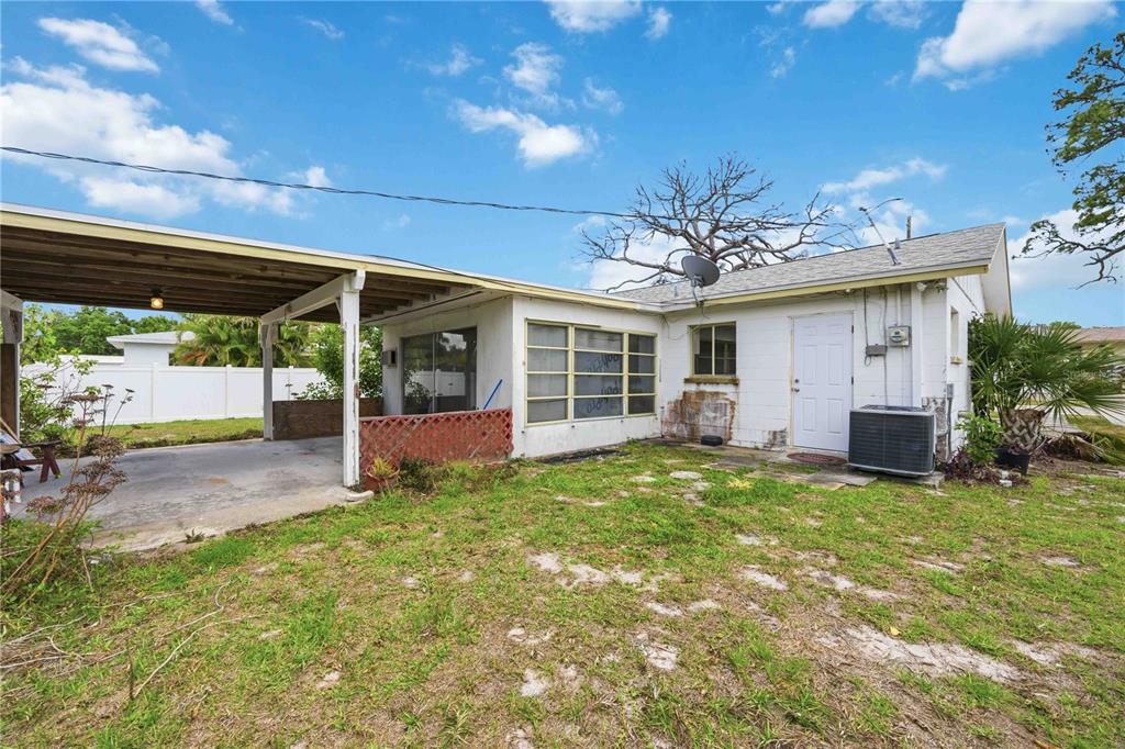 309 Base Avenue East Venice, FL 34285 - Photo 7 of 36 a view of a house with backyard and porch