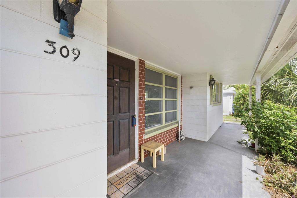 309 Base Avenue East Venice, FL 34285 - Photo 9 of 36 a view of an empty room with a window