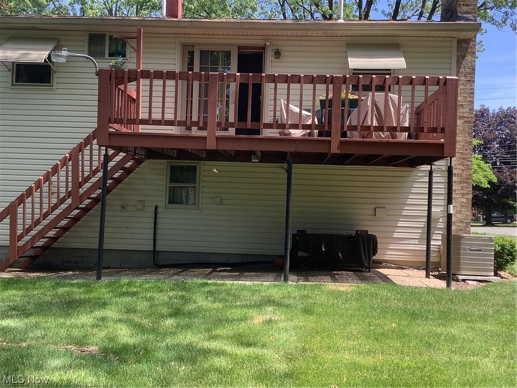 2320 South Meridian Road Austintown, OH 44511 - Photo 20 of 24 Back of house featuring a yard, a deck, and central air condition unit