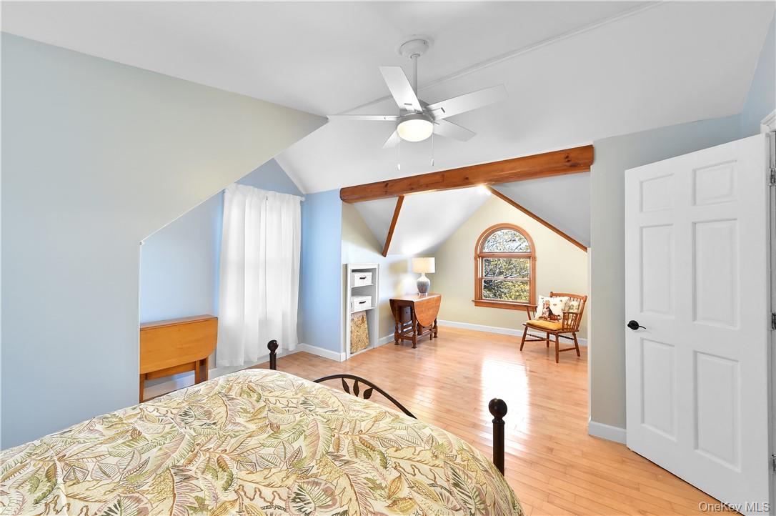 256 Ridge Road Campbell Hall, NY 10916 - Photo 19 of 36 Bedroom with vaulted ceiling with beams, light hardwood / wood-style floors, and ceiling fan