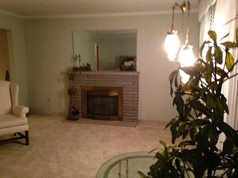 1235 Varner Road Whitehall, PA 15227 - Photo 5 of 18 Living Room. The stone fireplace is decorative but adds to the beauty of the room.