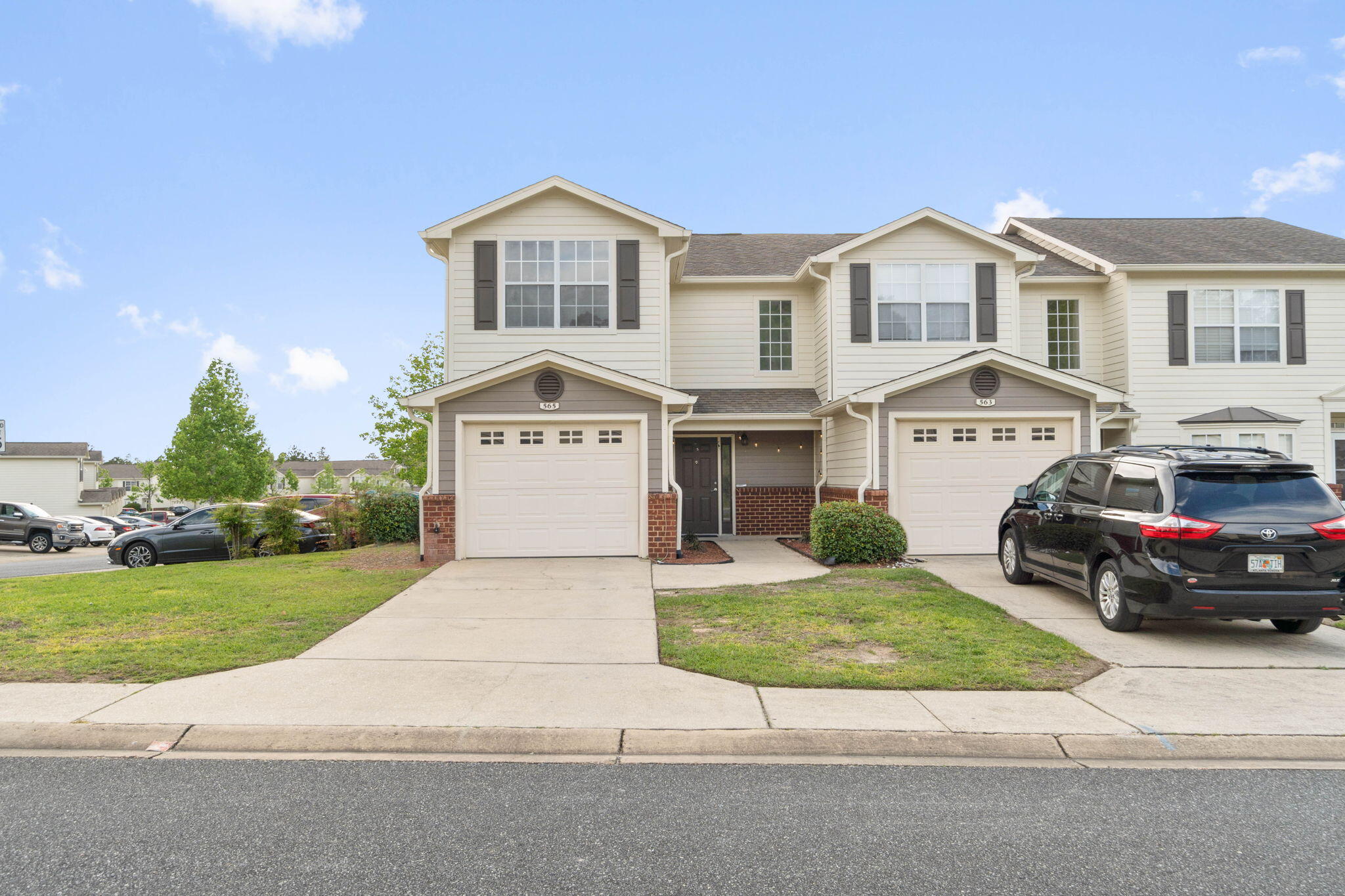 565 Wingspan Way Crestview, FL 32536 - Photo 1 of 39 a front view of a house with a yard and garage