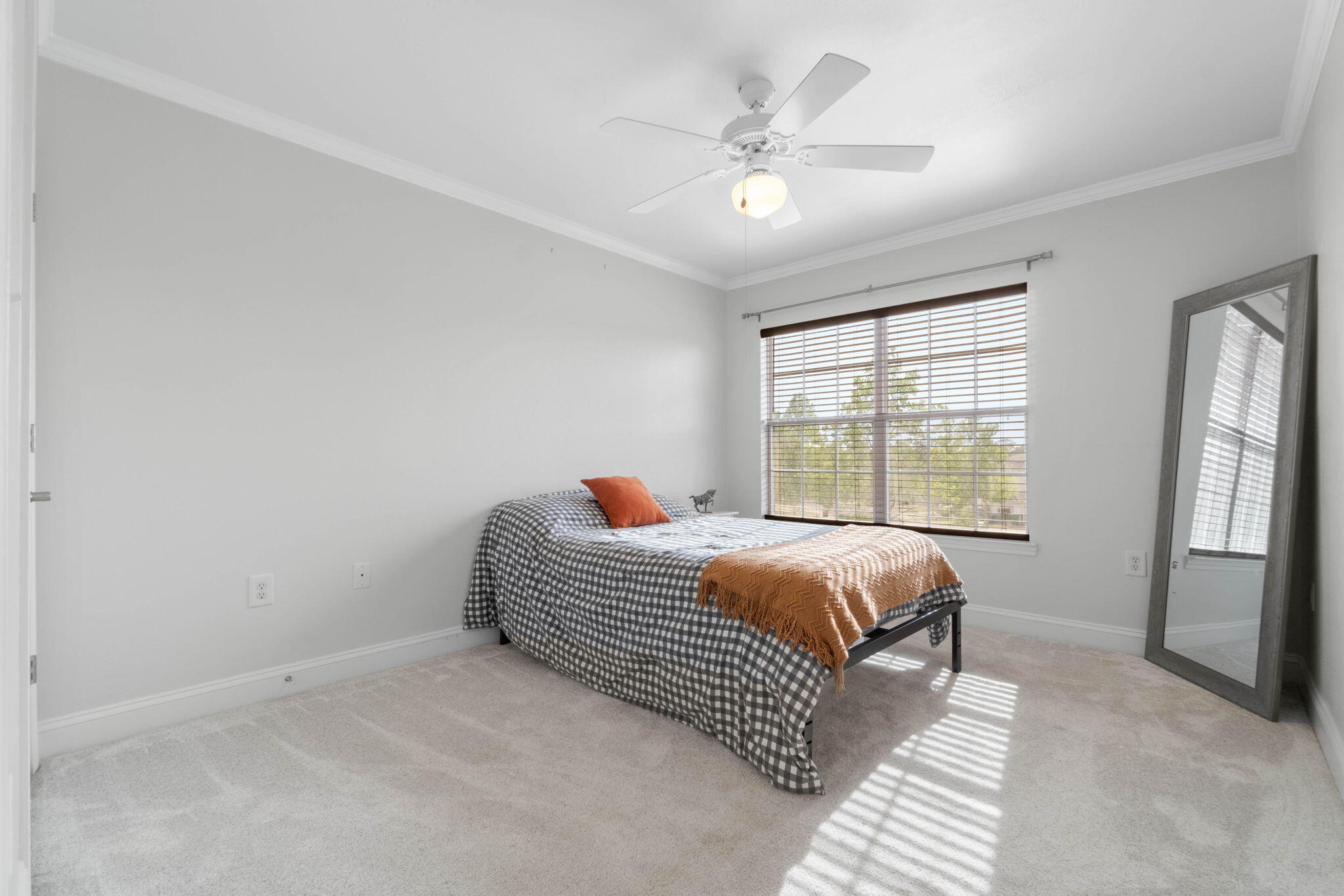 565 Wingspan Way Crestview, FL 32536 - Photo 19 of 39 a bed sitting in a bedroom next to a window