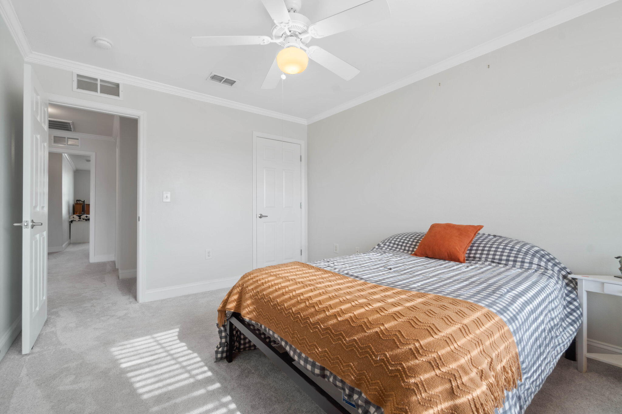 565 Wingspan Way Crestview, FL 32536 - Photo 20 of 39 a bedroom with a bed and a chandelier