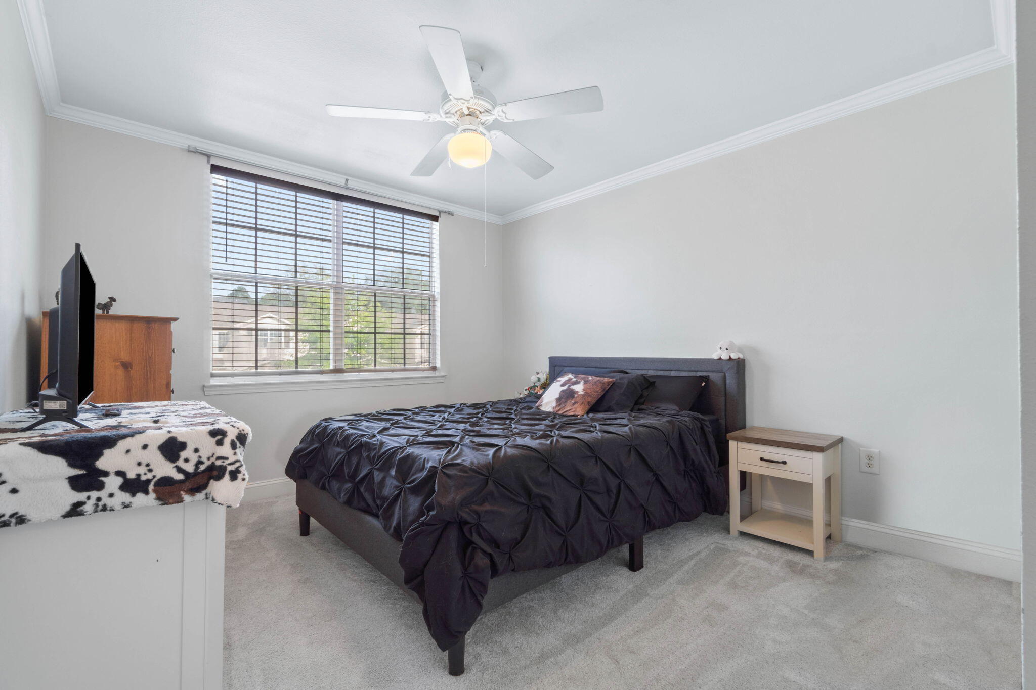 565 Wingspan Way Crestview, FL 32536 - Photo 26 of 39 a bedroom with a bed and a window