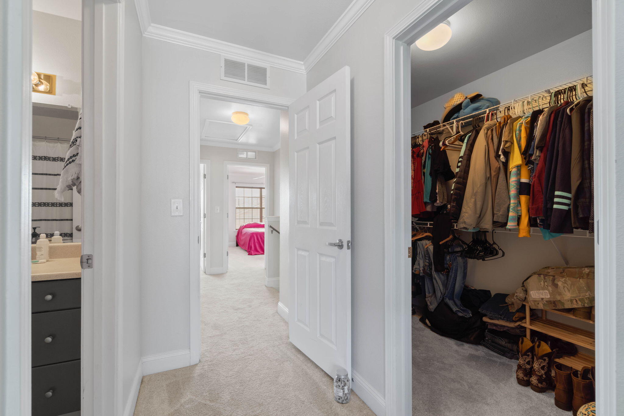 565 Wingspan Way Crestview, FL 32536 - Photo 29 of 39 a view of walk in closet with clothes and shoes