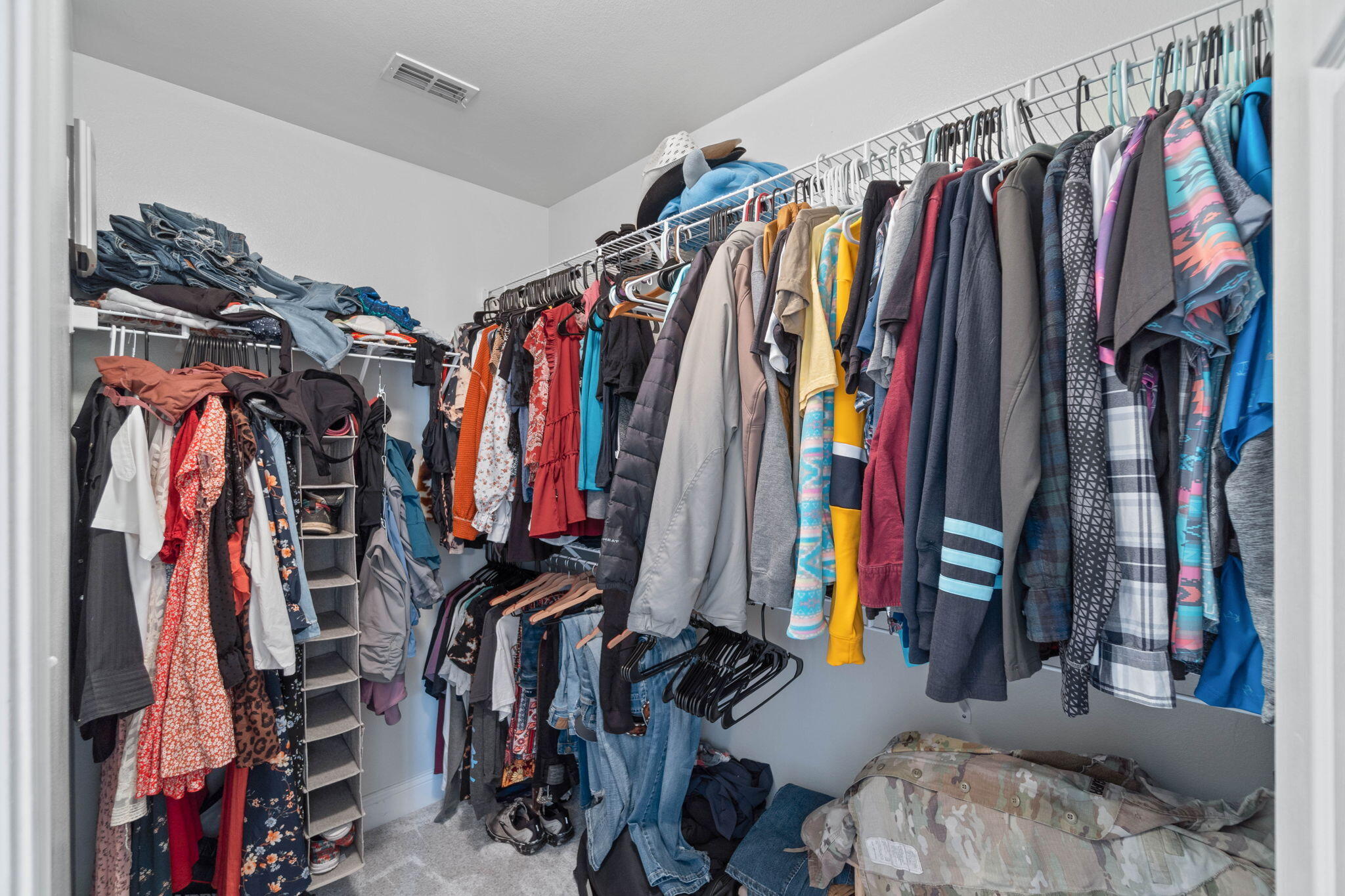 565 Wingspan Way Crestview, FL 32536 - Photo 30 of 39 a view of walk in closet with clothes