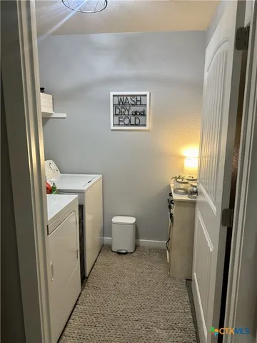 a bedroom with a bed and a desk