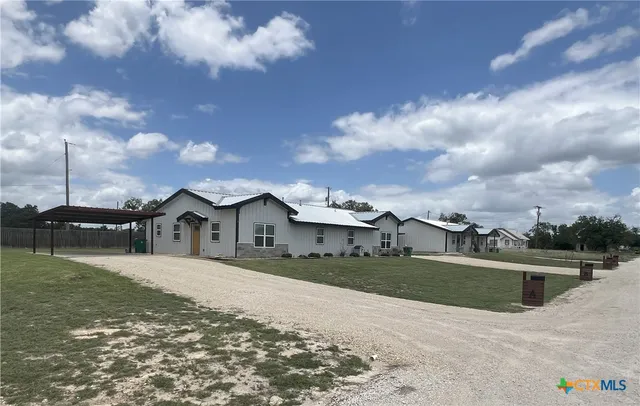 a house view with a garden space