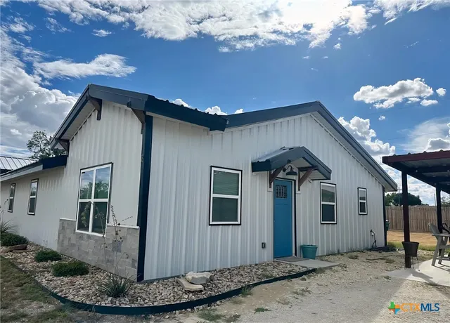 a view of a porch with seating space